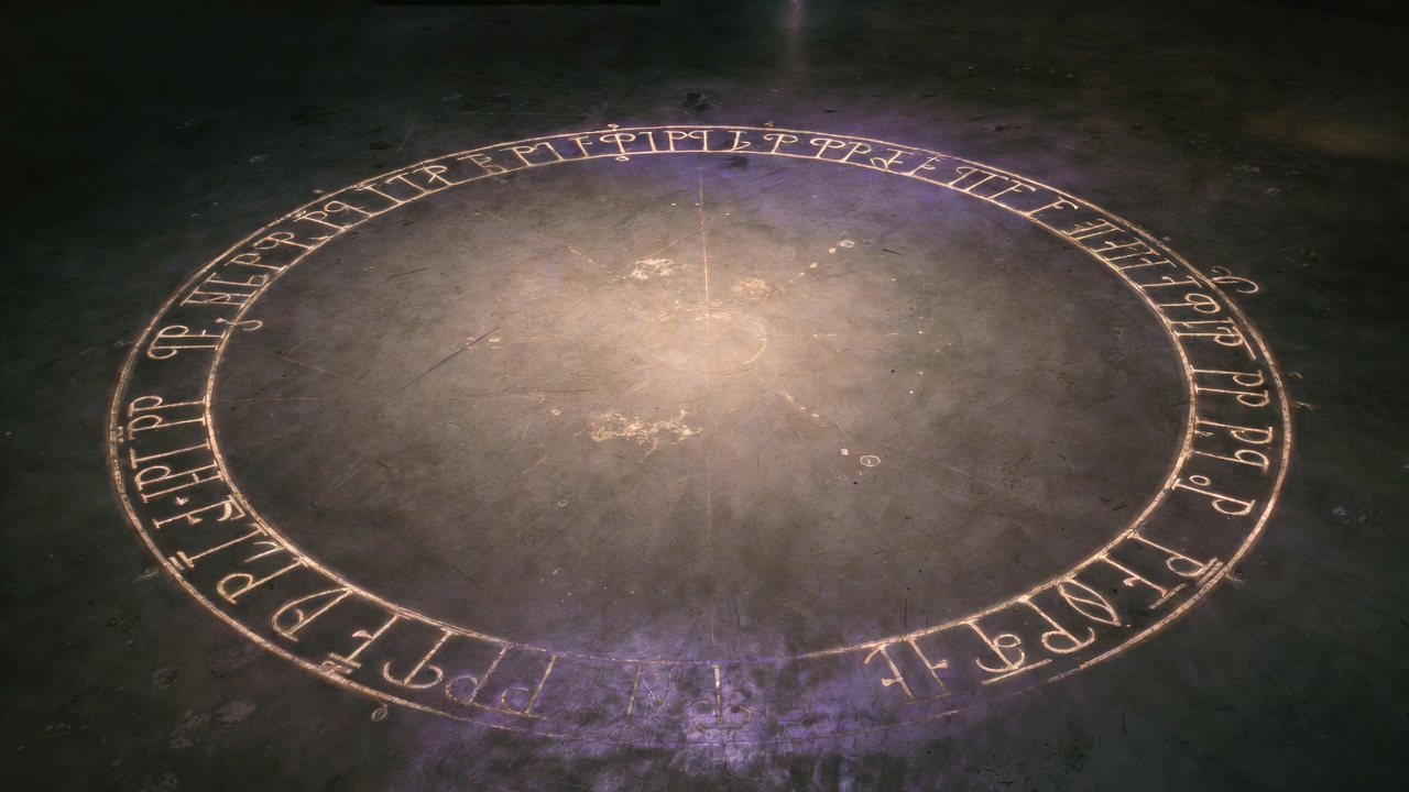 Top-down view of a chalk-drawn magical circle on dark concrete floor, Enochian characters around the inner band, empty center